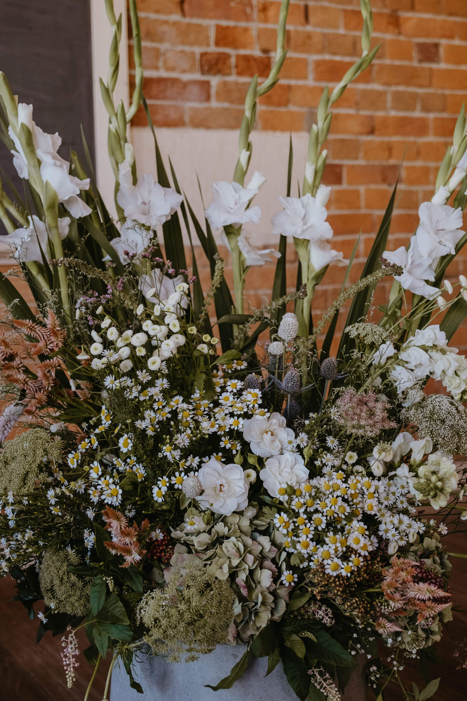 Close up of large flower arrangements on floor