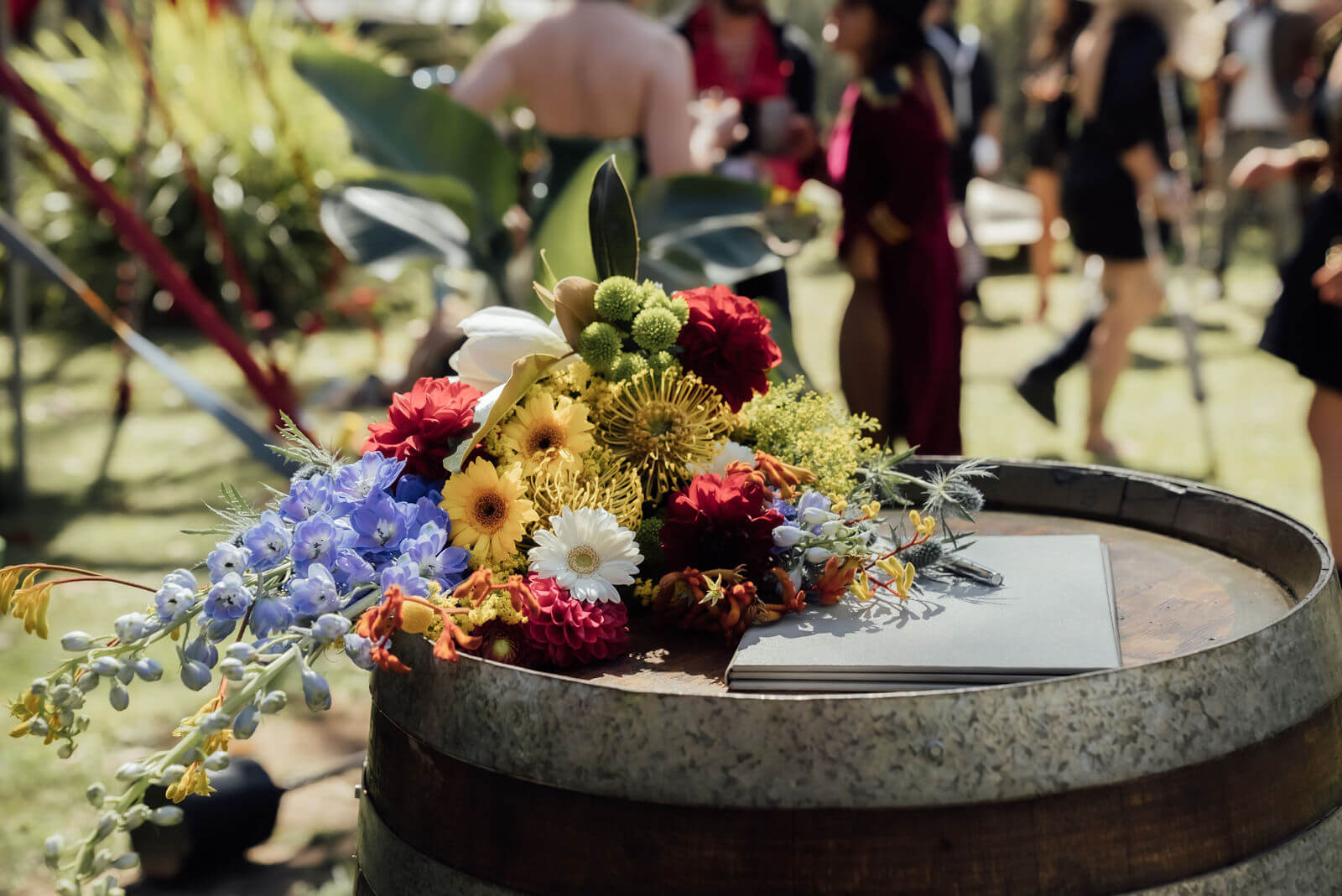 Brides bouquet on a wooden barrel.